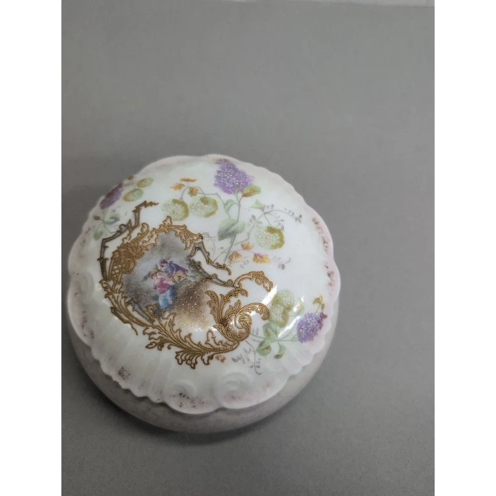 Vintage Porcelain Trinket Box with Gold Accents and Courting Design
